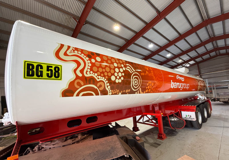 Orange and brown Aboriginal design signage on tanker truck installed in Karratha WA by C Signs Pilbara