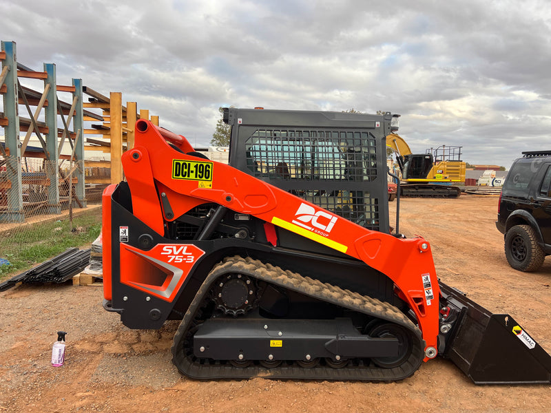Orange skid steer machinery with branded safety decals installed on construction site in Karratha Pilbara