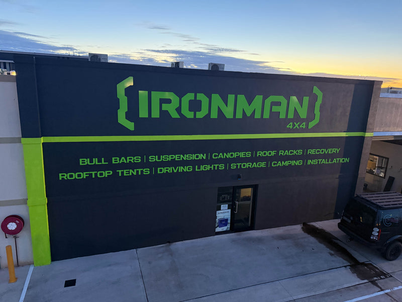 Green IRONMAN 4x4 warehouse signage installed on commercial building in Karratha WA by C Signs Pilbara 