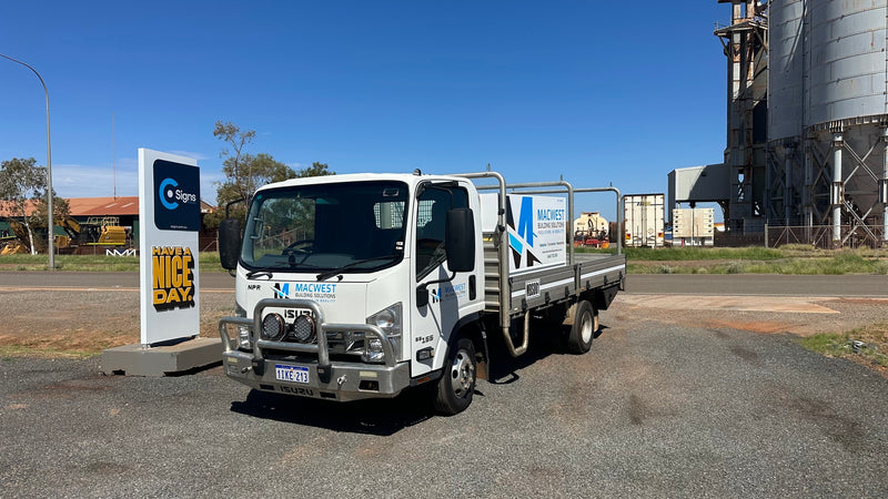 Blue and black custom vehicle graphics for Macwest Building Solutions installed to service truck in Karratha WA by C Signs Pilbara