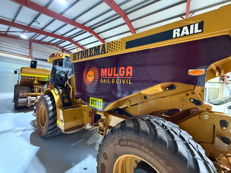 Mulga Rail & Civil branded Hydrema tipper truck featuring custom signage completed by C Signs in Karratha.