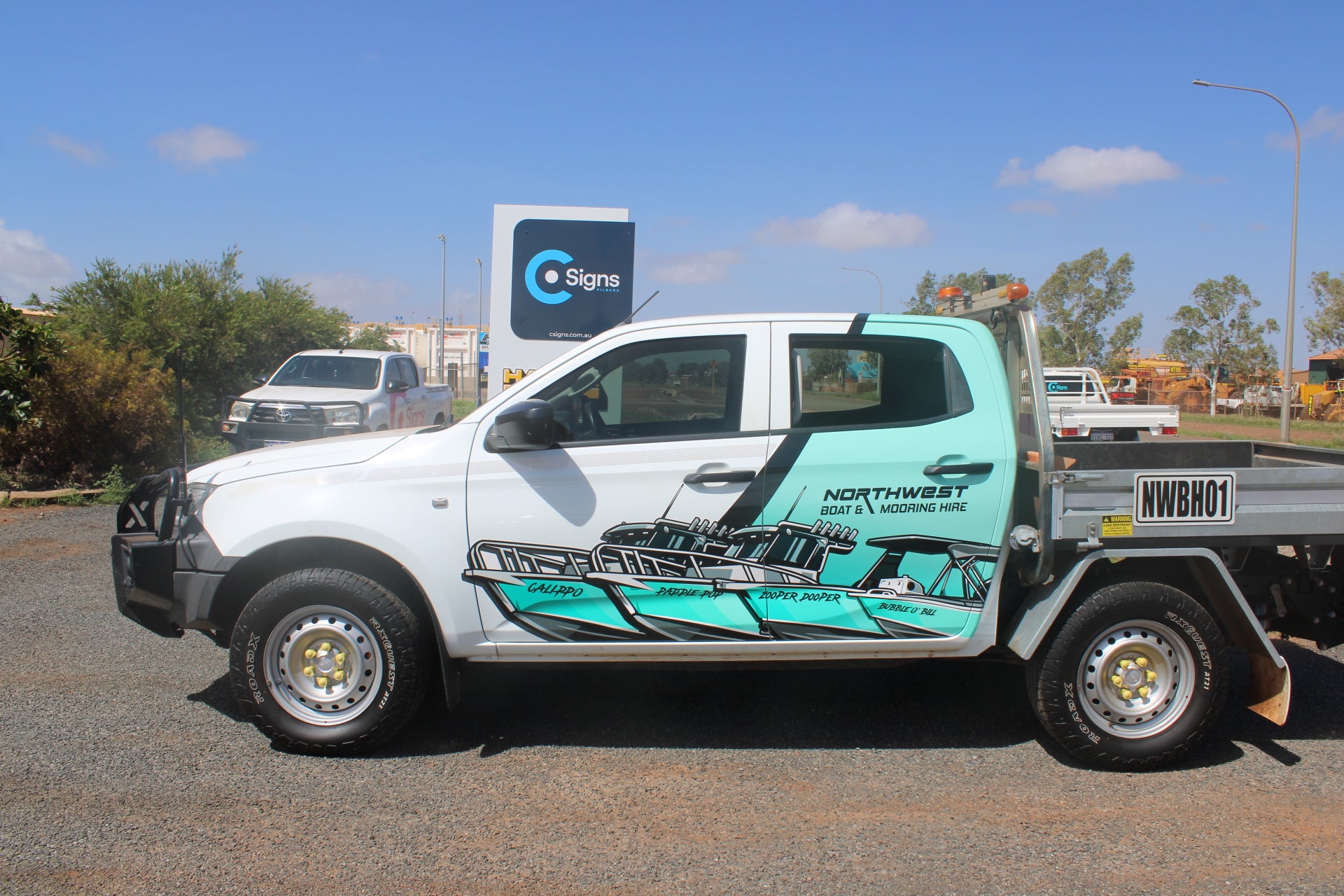 White ute with teal custom vehicle wrap installed in Karratha WA by C Signs Pilbara