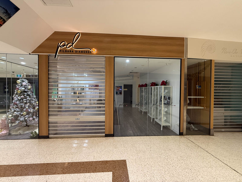 Pilbara Diamonds timber shopfront, entry signage installed above a glazed commercial entrance in Karratha by C Signs