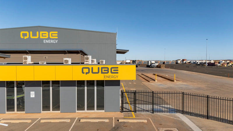 External building signage for QUBE Energy installed by C Signs in Karratha, showcasing bold commercial signage for a Pilbara industrial site
