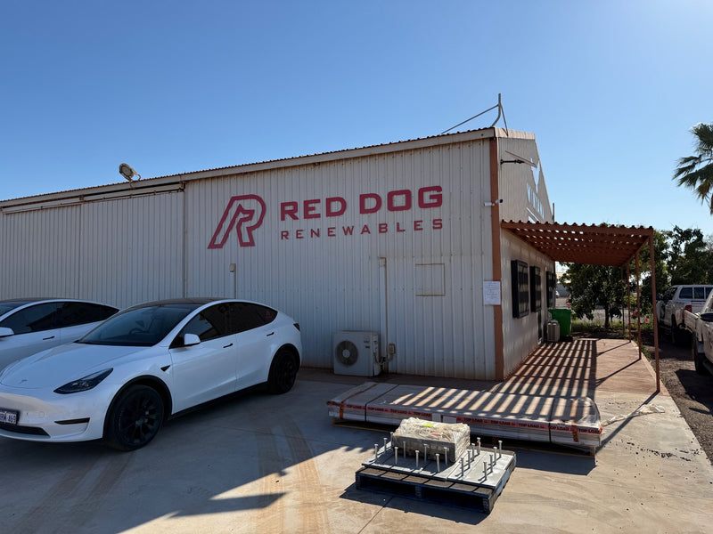 Red Dog Renewables building signage on an industrial workshop exterior, installed in Karratha by C Signs