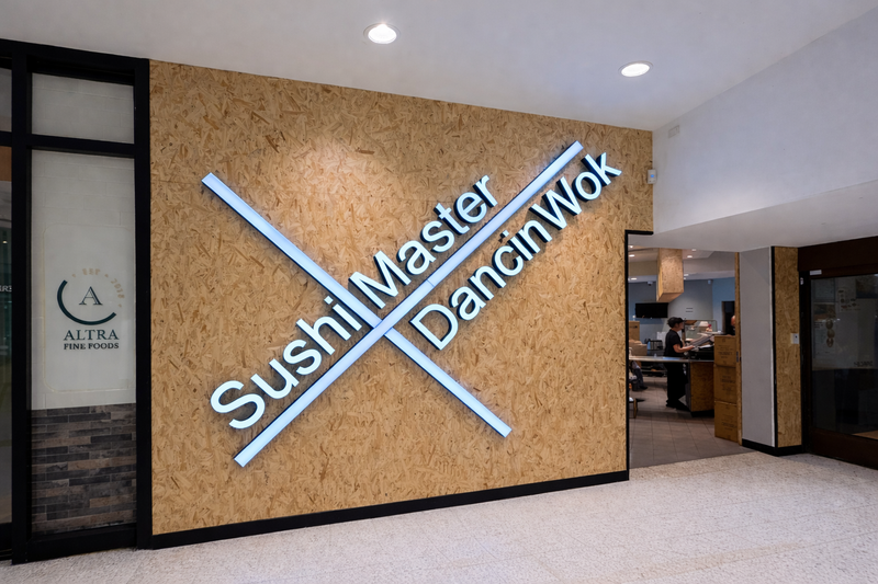 Sushi Master interior illuminated wall sign in Karratha mounted to a timber feature wall by C Signs 