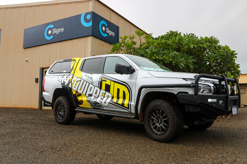 Silver Mitsubishi Triton with TJM 4x4 Equipped Branding, Installed by C Signs Pilbara in Karratha.