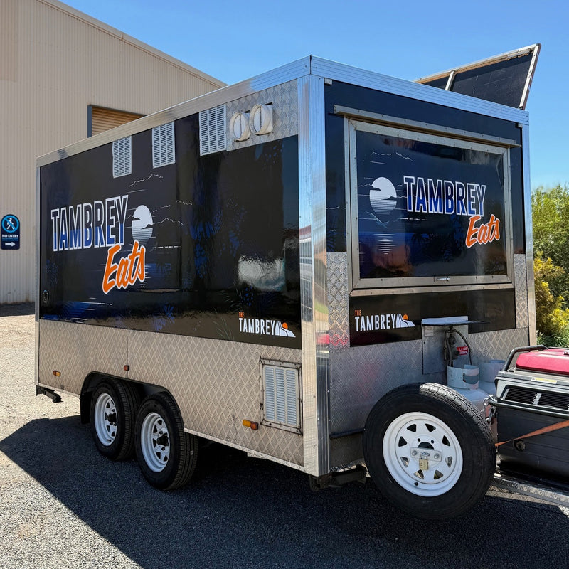 Tambrey Eats deep blue food van graphics installed in Karratha WA