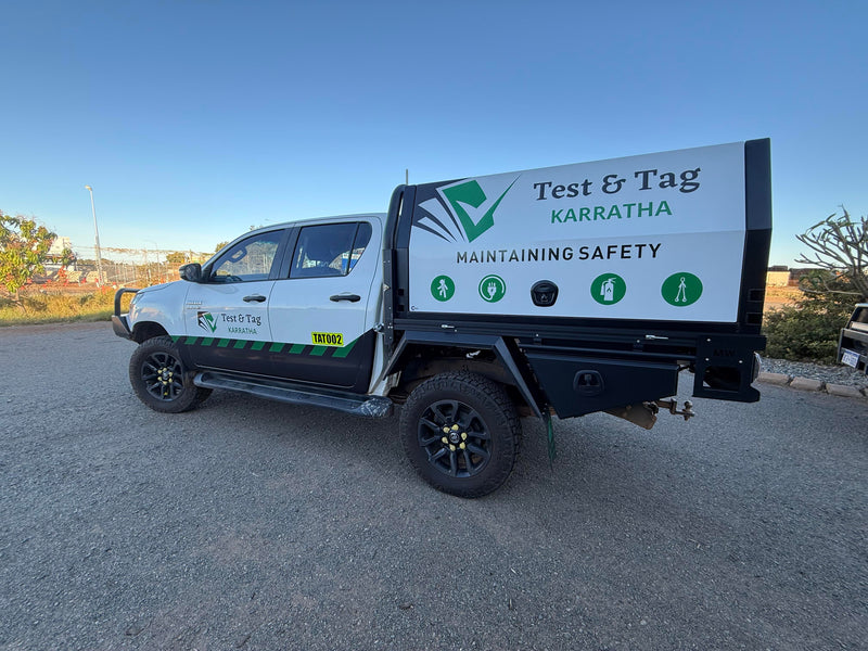 Custom business vehicle graphics installed to white work ute in Karratha WA by C Signs Pilbara