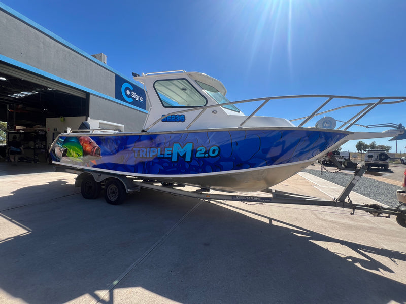 Boat wrap with blue custom graphics for Triple M 2.0 installed in Karratha WA by C Signs Pilbara