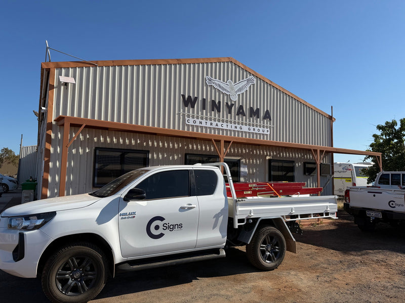 Winyama Contracting Group signage installed on industrial warehouse in Karratha WA by C Signs Pilbara